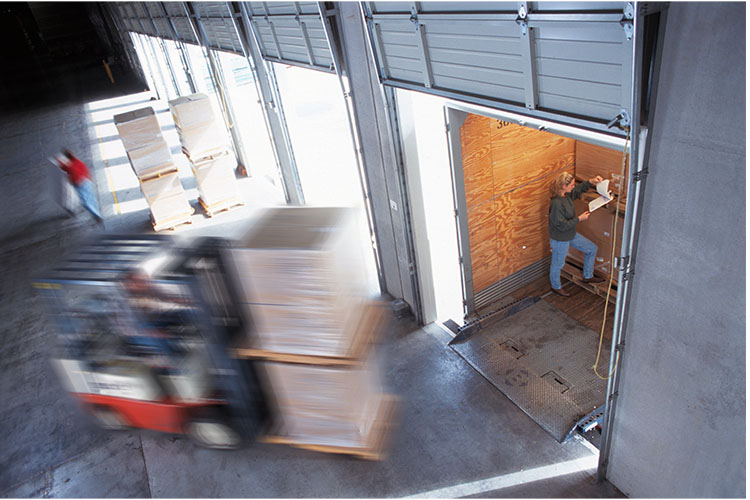 _0001_employees-loading-cardboard-boxes-of-products-into-2022-03-04-02-24-15-utc