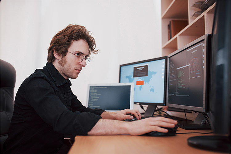 _0002_male-programmer-working-on-desktop-computer-with-m-2021-08-29-00-35-15-utc