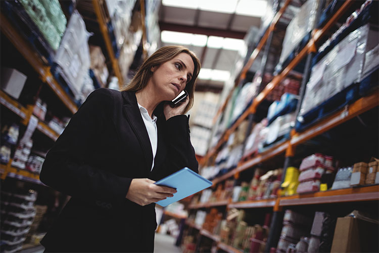 _0001_businesswoman-on-a-phone-call-in-warehouse-2021-08-28-16-43-24-utc