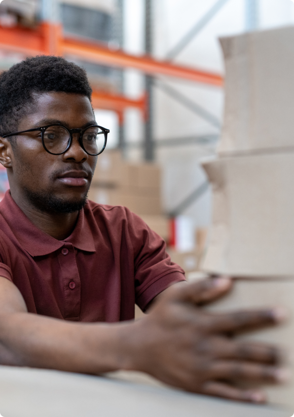 african-american-warehouse-employee-adjusting-boxe-2021-09-24-03-41-30-utc (1) 2