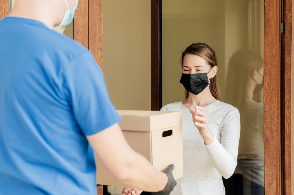 close-up-man-delivering-order 1