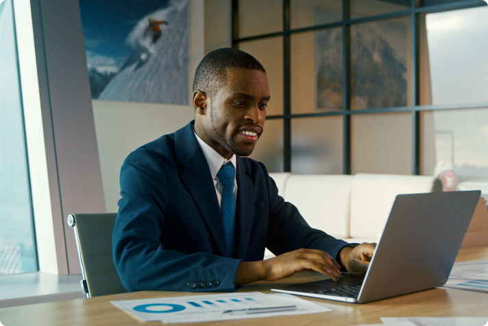 young man on a laptop creating reports young man on a laptop creating reports